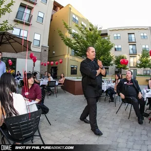 a man speaking to a crowd of people