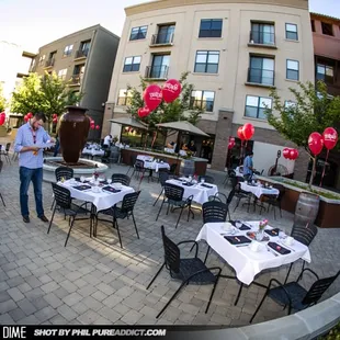 a man standing in front of a restaurant