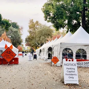 a street lined with tents and signs