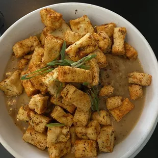 Biscuits and gravy with tofu added. Generous amount of tofu!