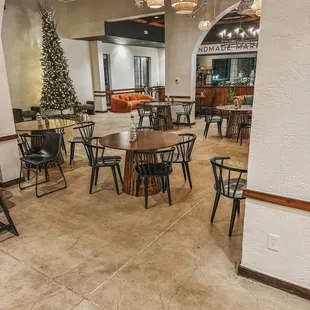 a dining area with tables and chairs