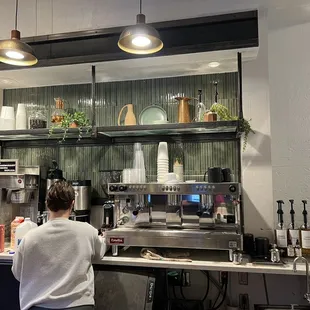 a woman working in a coffee shop