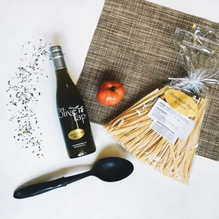 a bottle of wine and a spoon