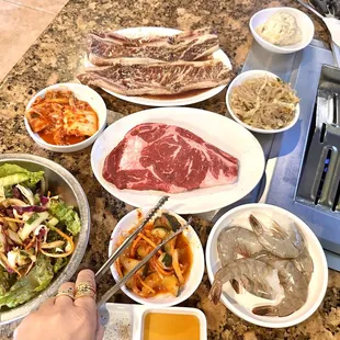 Marinated  Beef Short Ribs ,  Rib eye steak , Shrimps  , Salad , Kimchi , etc