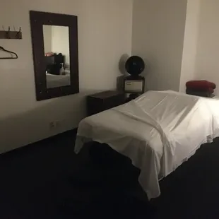 One of our six cozy massage therapy rooms