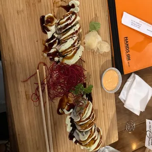 a plate of food on a chopping board