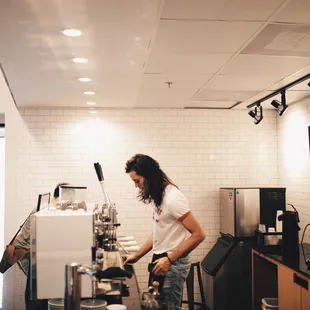 a man working in a coffee shop