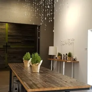 a table and chairs in a large room