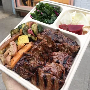 Galbi - Premium Quality Marinated Beef short rib and Roasted Vegetables. Purple Rice, salad, pickle.