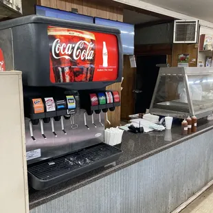 a coca cola machine in a restaurant