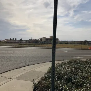 The view westward from the sidewalk in front of the park&apos;s sign.