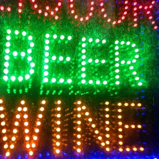 a neon sign in a store window
