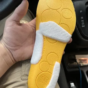 Custom pads affixed to the insoles for support.