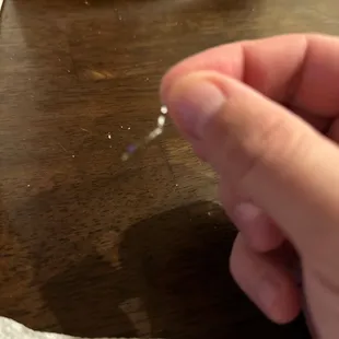 a hand holding a needle