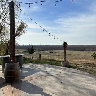 patio with wine barrels and string lights