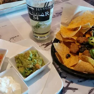 Hanger Style Nachos with chorizo, black beans, green onion.