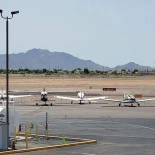 several airplanes on the tarmac at an airport