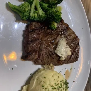 Ribeye steak with mashed potato and broccoli.  The mashed potato was outstanding and the broccoli was real good but the steak not so much