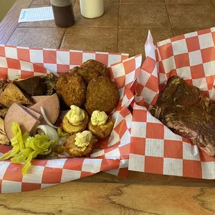 Meat Sampler Platter with deviled eggs, fried green tomatoes and a side of ribs.