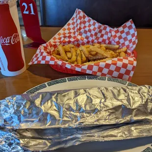 a plate of french fries and a drink