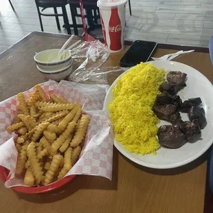 Lamb tikka with yellow rice and a side of fries instead of hummus