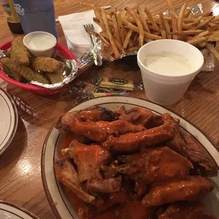 Awesome wings! Hot is more like medium. Also fresh fries and fried pickle spears.