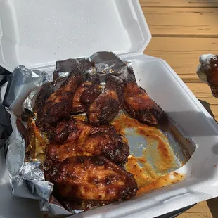 Dry rub wings tossed in their homemade bbq sauce