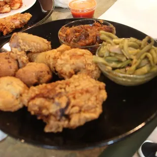 a plate of fried chicken and green beans