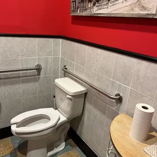 a toilet with a roll of toilet paper