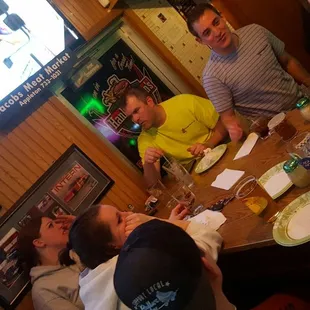 a group of people sitting around a table