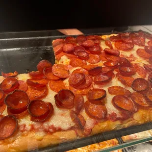 a slice of pepperoni pizza