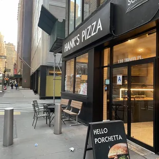 a sign in front of a restaurant