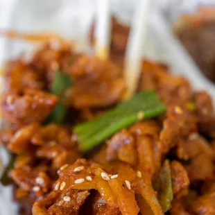 Spicy Pork Bulgogi comes w/ two sides and japchae ($18)