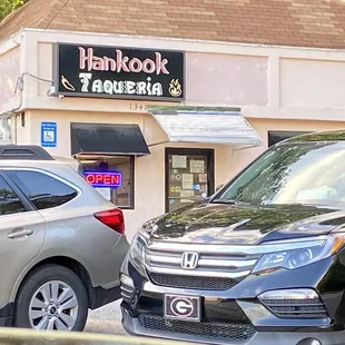 a car parked in front of a restaurant