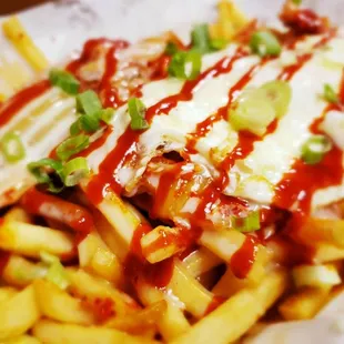 french fries with ketchup and cheese