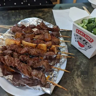 meat skewers and cucumber