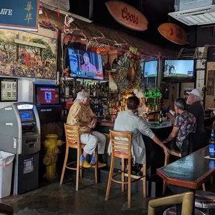 people sitting at the bar