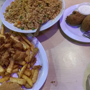 Fried shrimp, trio fried rice includes shrimp, crawfish and chicken, an a order of boudain cheese balls