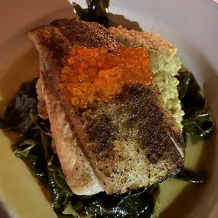 NC Trout topped with Roe, cushioned with collards and polenta stacked beneath. The best I&apos;ve ever experienced of these tasty treats!