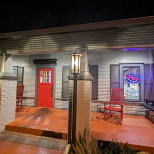 the front of the restaurant at night