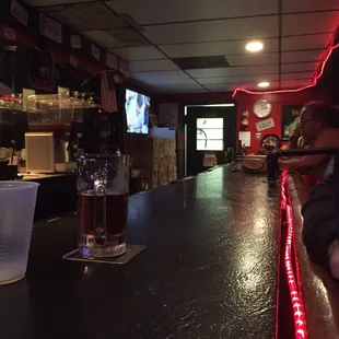 a bar with a television in the background