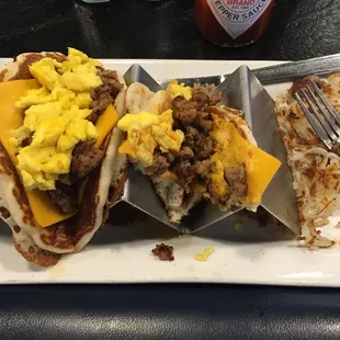 Breakfast tacos scrambled eggs sausage cheese wrapped in a pancake with maple syrup very good I&apos;m very different!