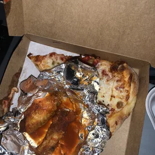 Pizza slice with sausage and wings.