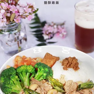a plate of rice, broccoli, and chicken