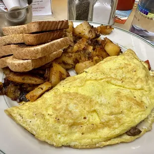 Steak Omelet , home fries and toast.
