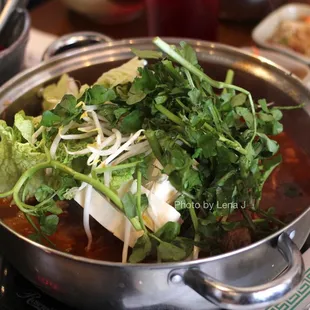 Gamjatang A  ($37.95) - Pork backbone soup w/ potatoes, tofu, napa, watercress, beansprouts