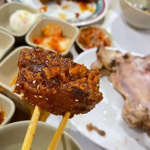 a plate of food with chopsticks