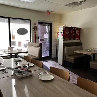 a dining room with a table and chairs