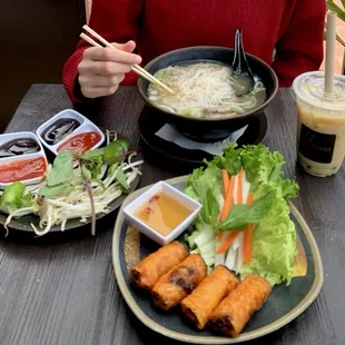 Pictured: Beef Pho and toppings plate, fried egg rolls (appetizer), Jasmine (iced) boba tea.