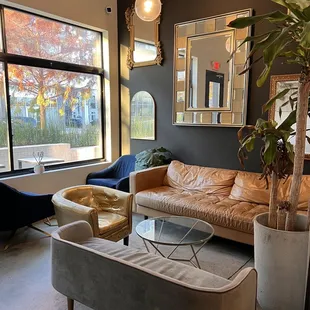 a living room with a couch, chair, and coffee table